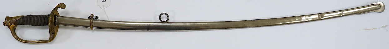 A 1954 US Marine Wilkinson Sword belonging to Staff Sergeant James Devereux 2nd believed to be son of General Devereux, etched blade, regulation brass hilt, in its plated scabbard, blade 76.5cm. Condition - good
